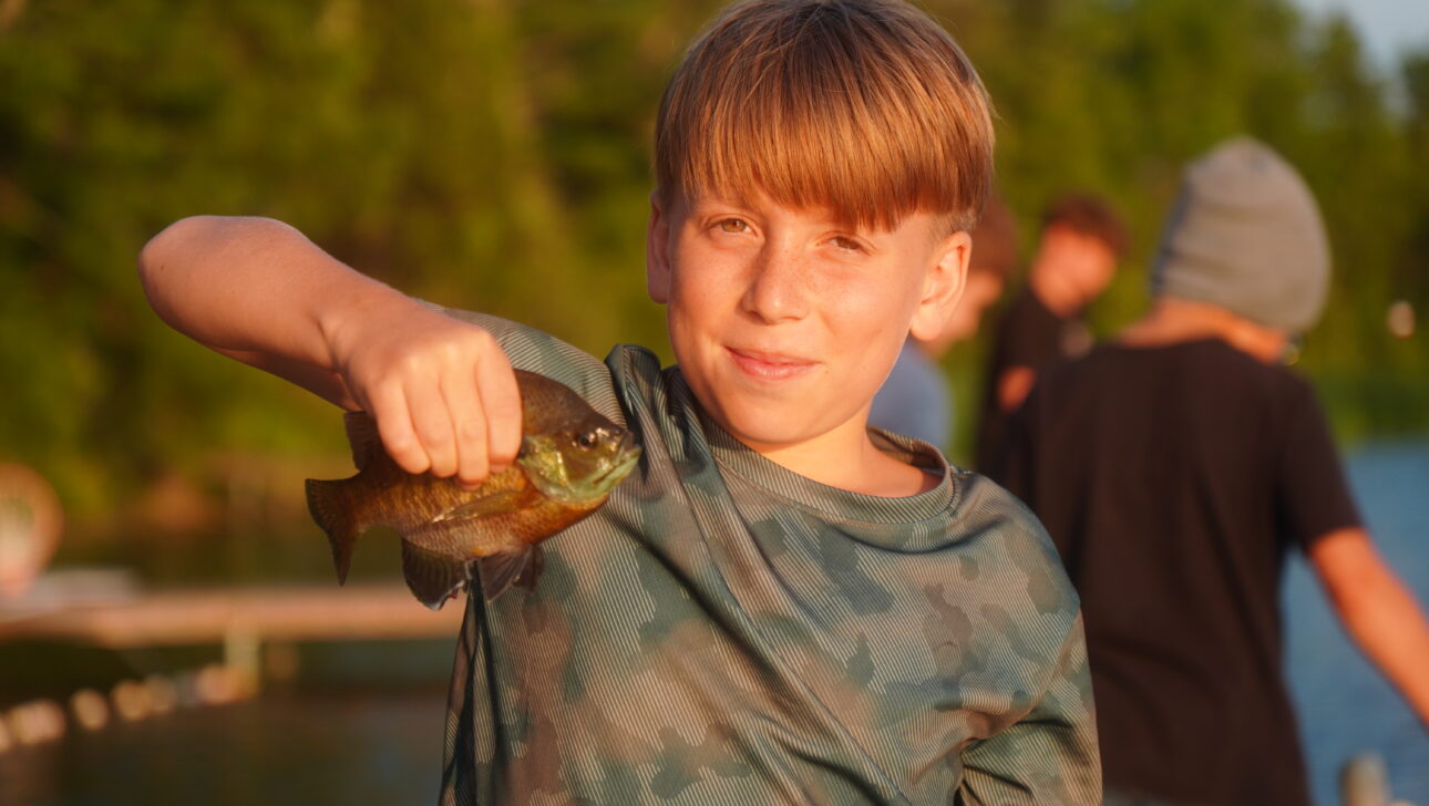 camper holding a sunfish