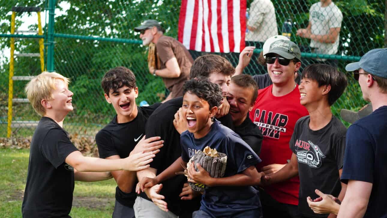 campers celebrating during a softball game