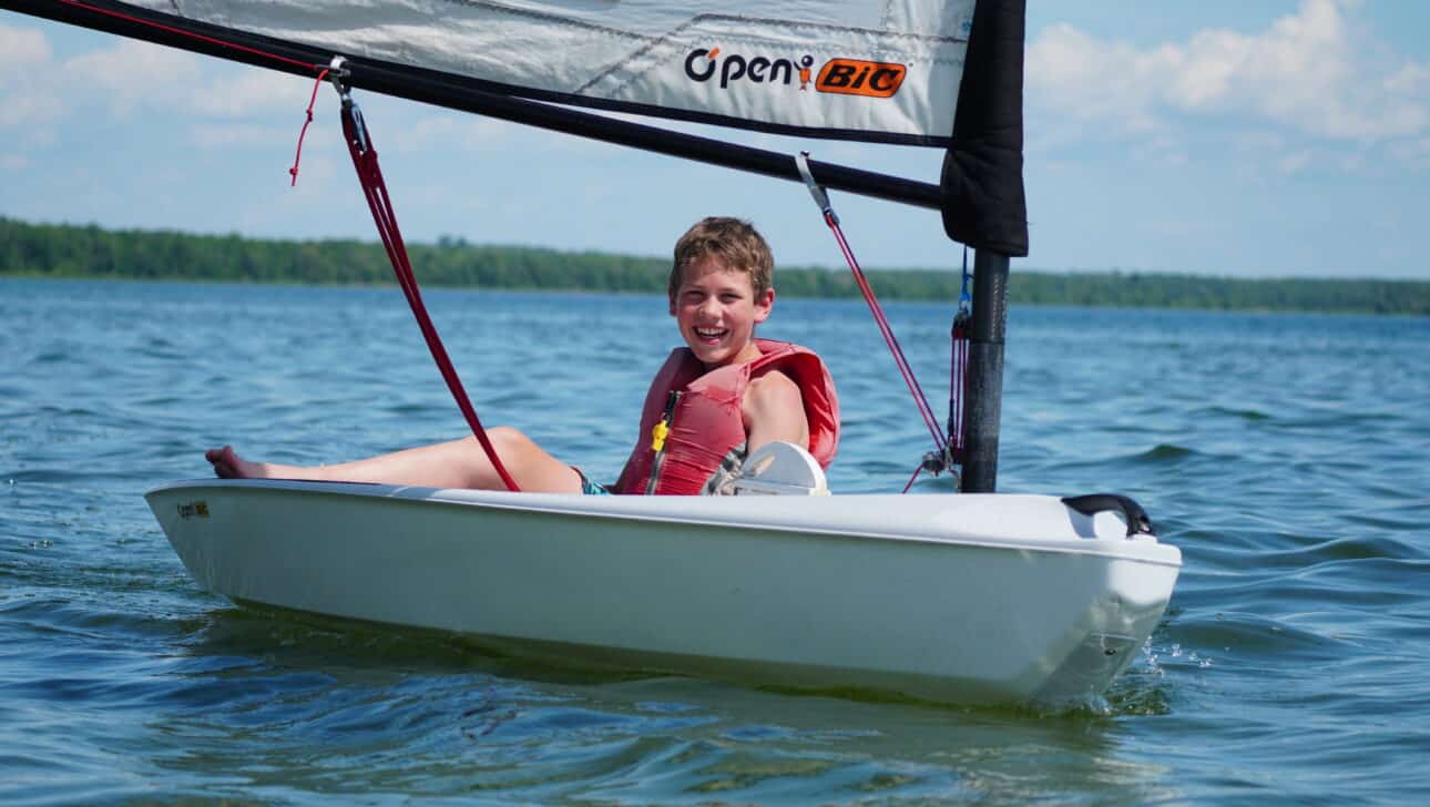 camper sailing a boat
