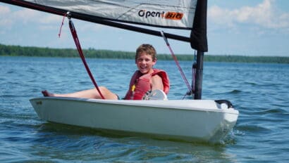 camper sailing a boat