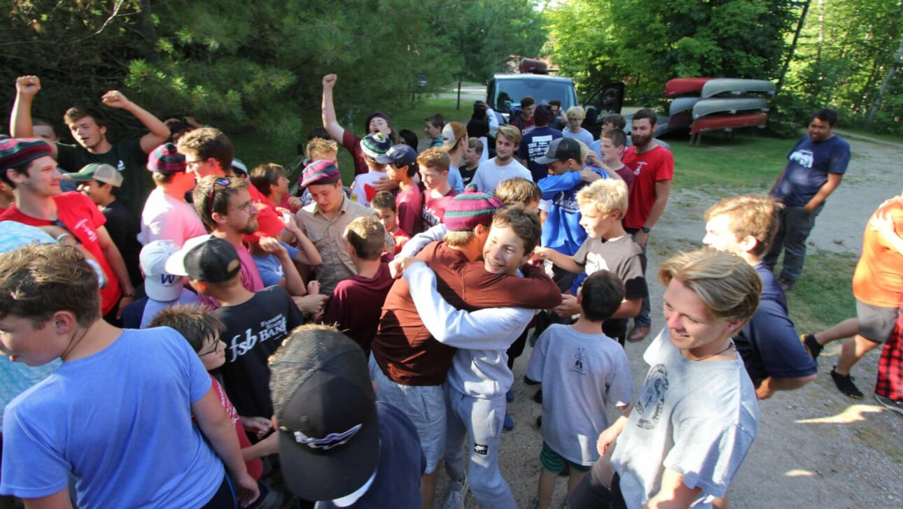 campers coming to meet trippers when they return to camp.