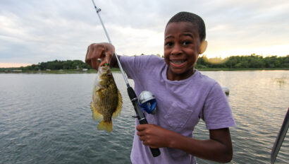 A young boy fishing.