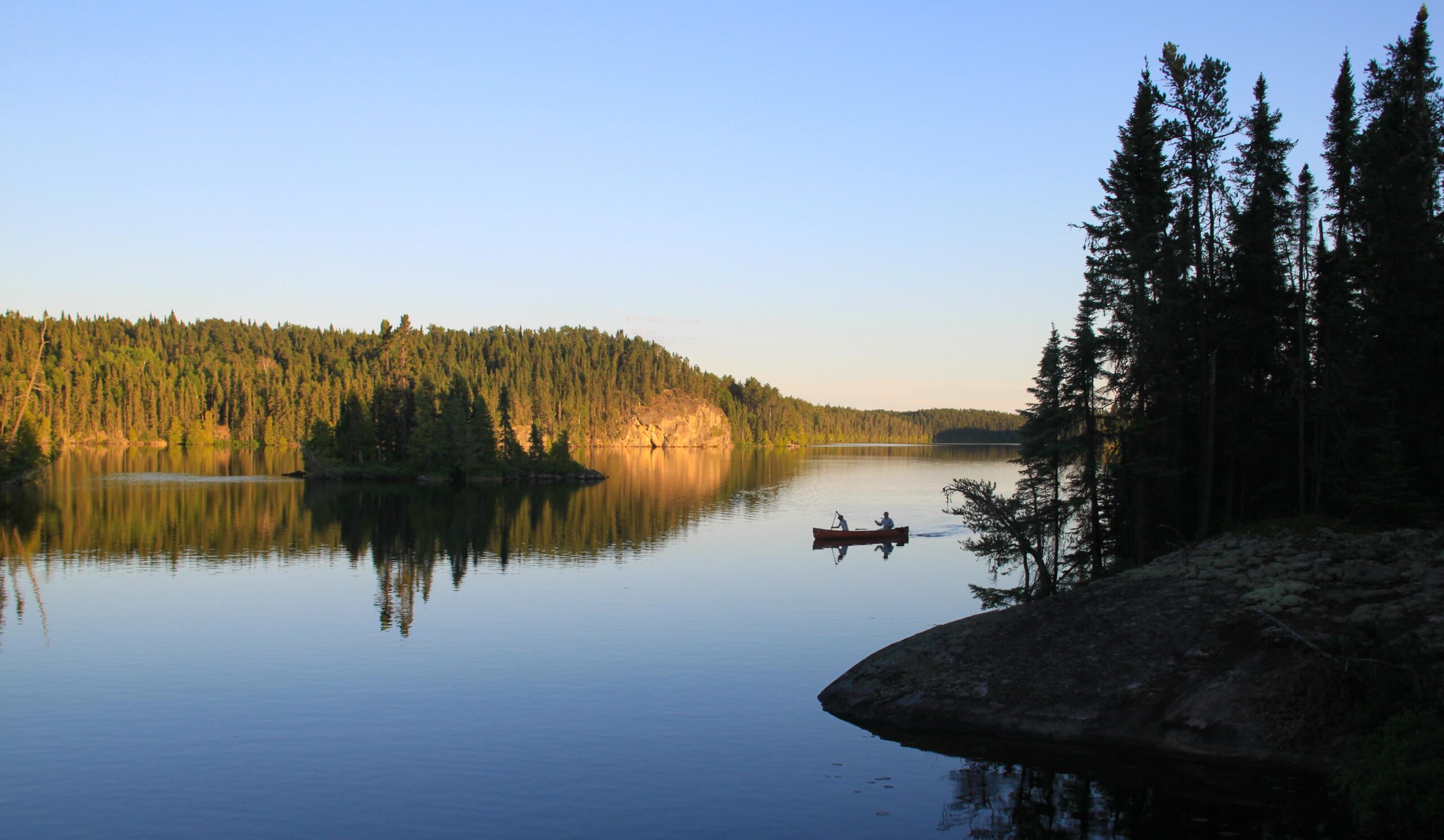 Canoe on calm lake