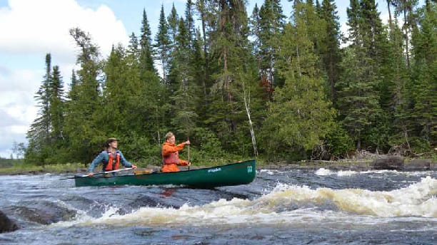 canoe on rapids.