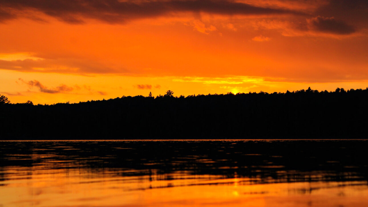 orange sunset over a lake.
