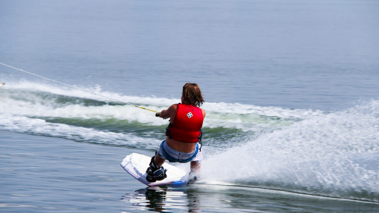 boy wakeboarding.