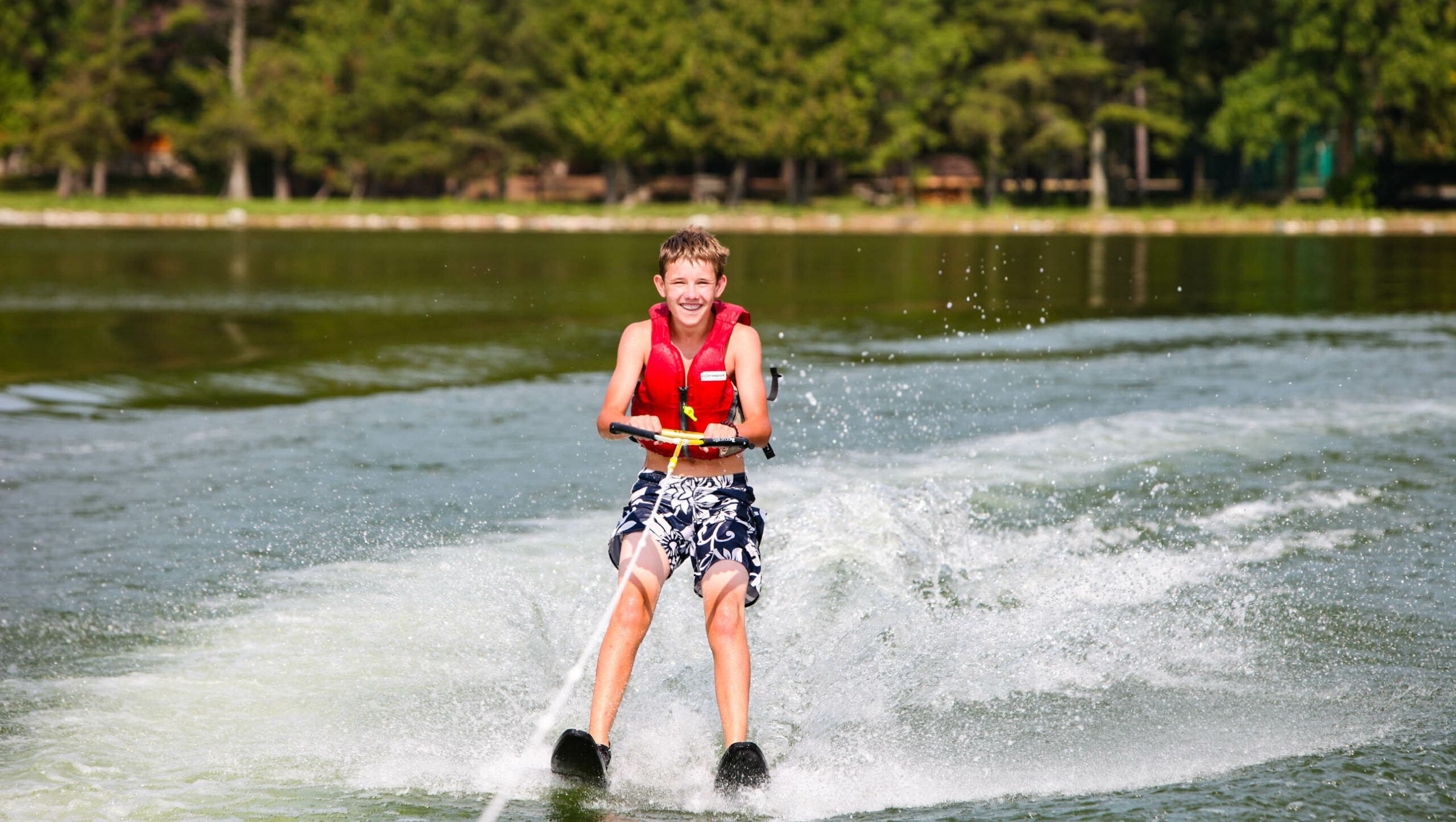 boy waterskiing.