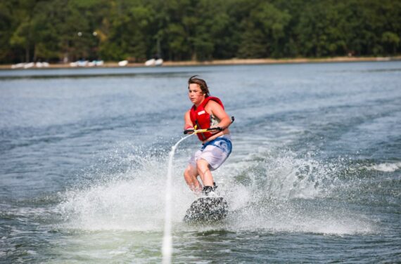 boy waterskiing.