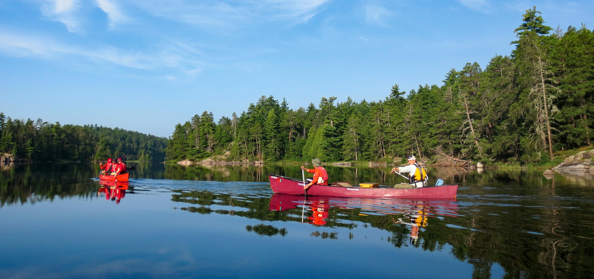 two canoes on a river.