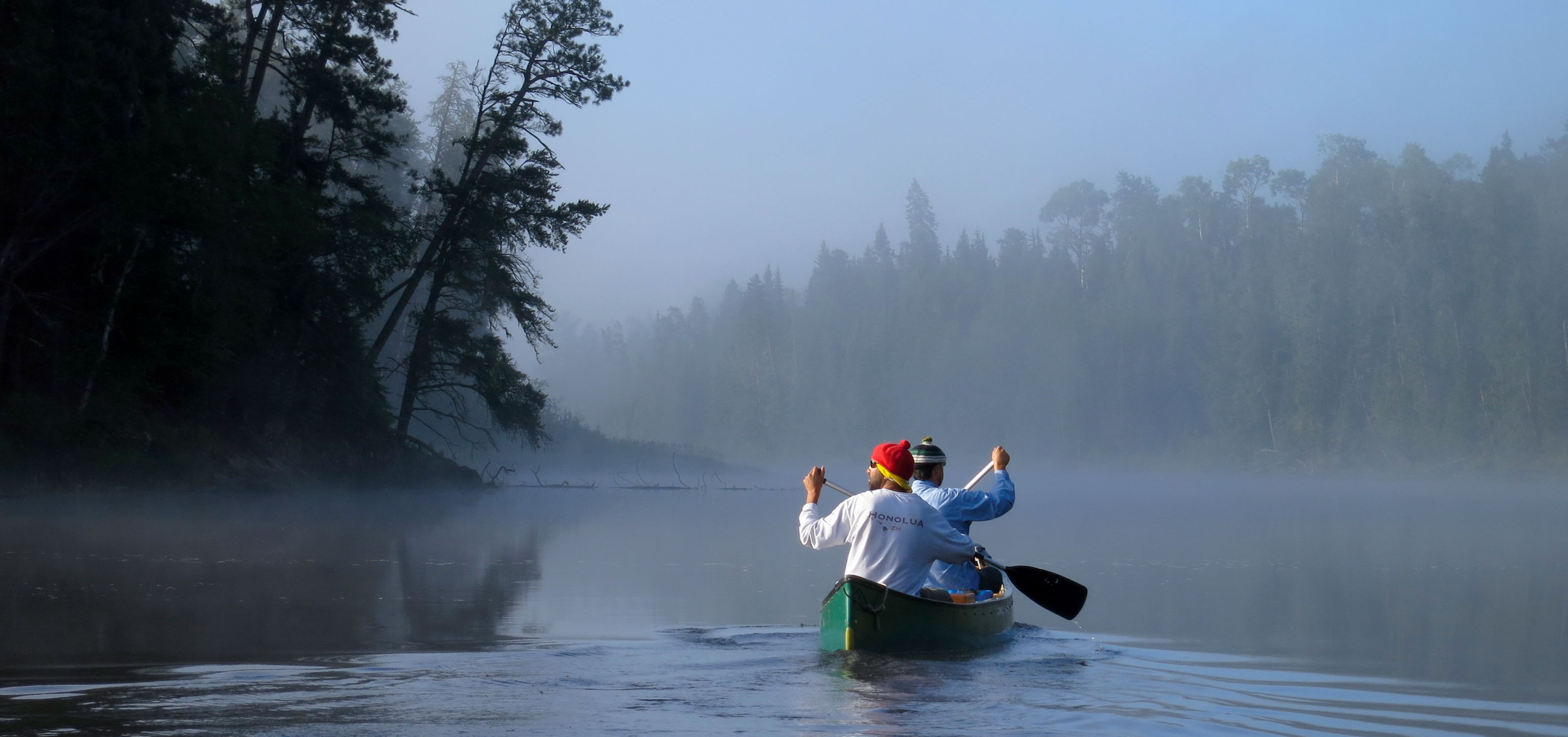 canoe on a misty river.