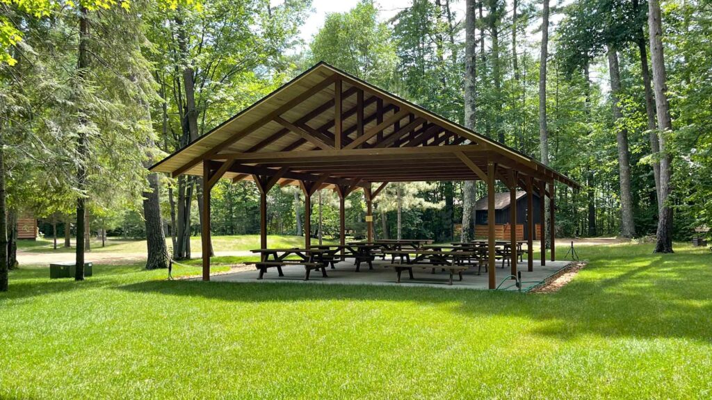 empty outdoor pavilion with picnic tables.