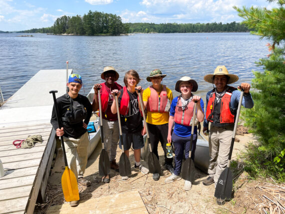 Six boys about to go on a local canoe trip.