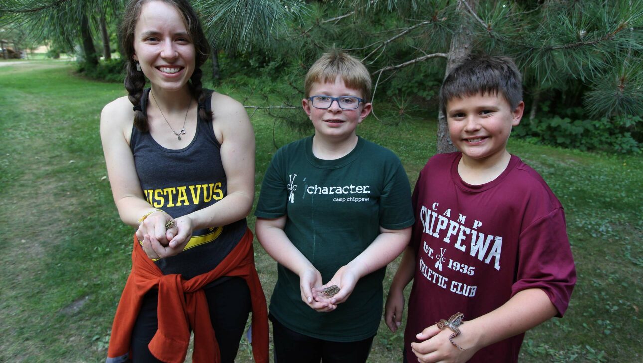 campers holding frogs.