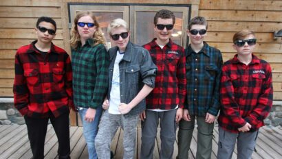 campers dressed in flannel shirts and sunglasses.