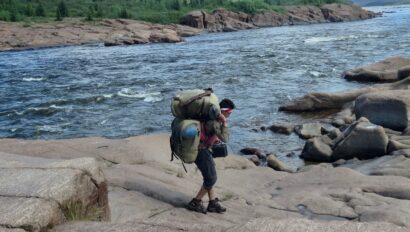 portaging-duluth-packs-on-a-cliff-around-rapids.