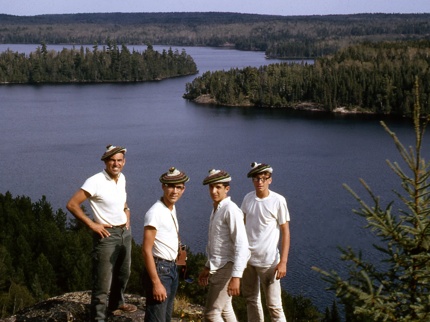 Posing atop a cliff in the gorgeous Canadian Wilderness during a summer camp canoe trip.