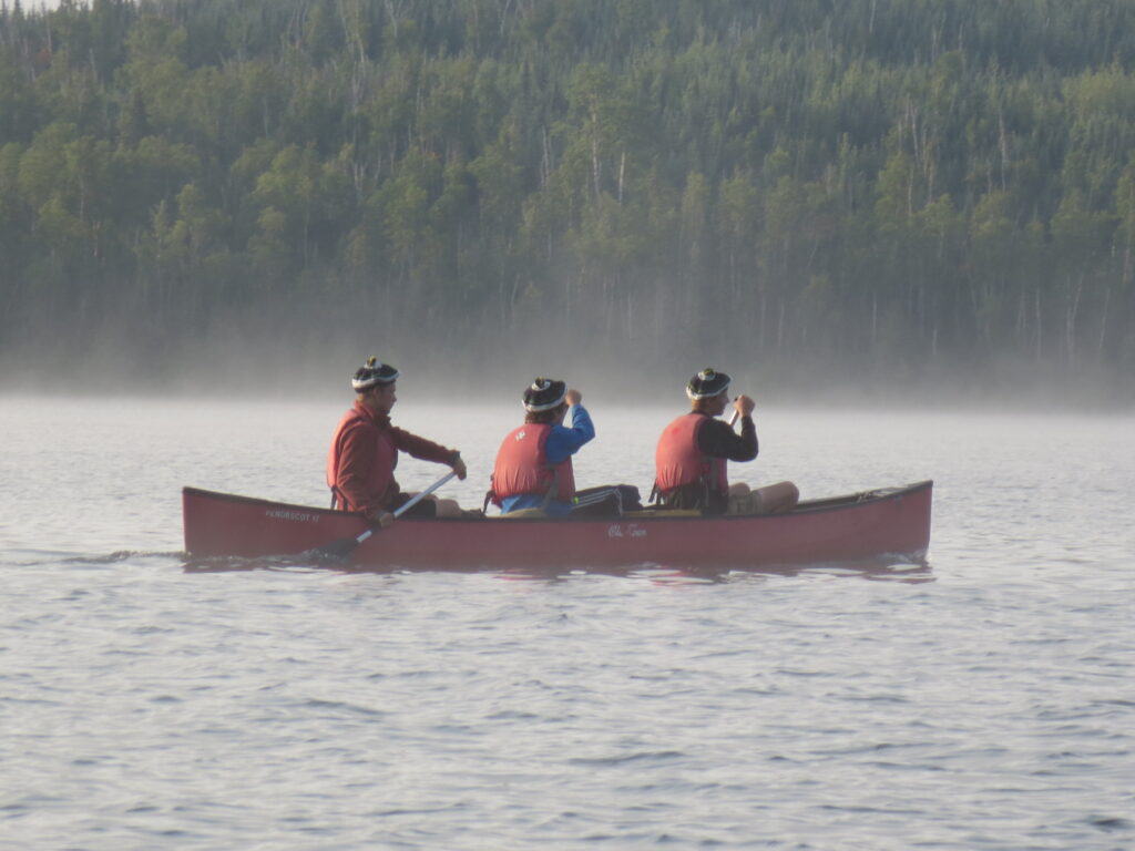 Canoeing through mist on a Camp Chippewa for Boys canoe trip.