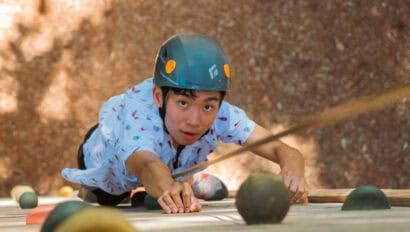 Climbing the sentinel climb at the summer camp Camp Chippewa for Boys in Minnesota.