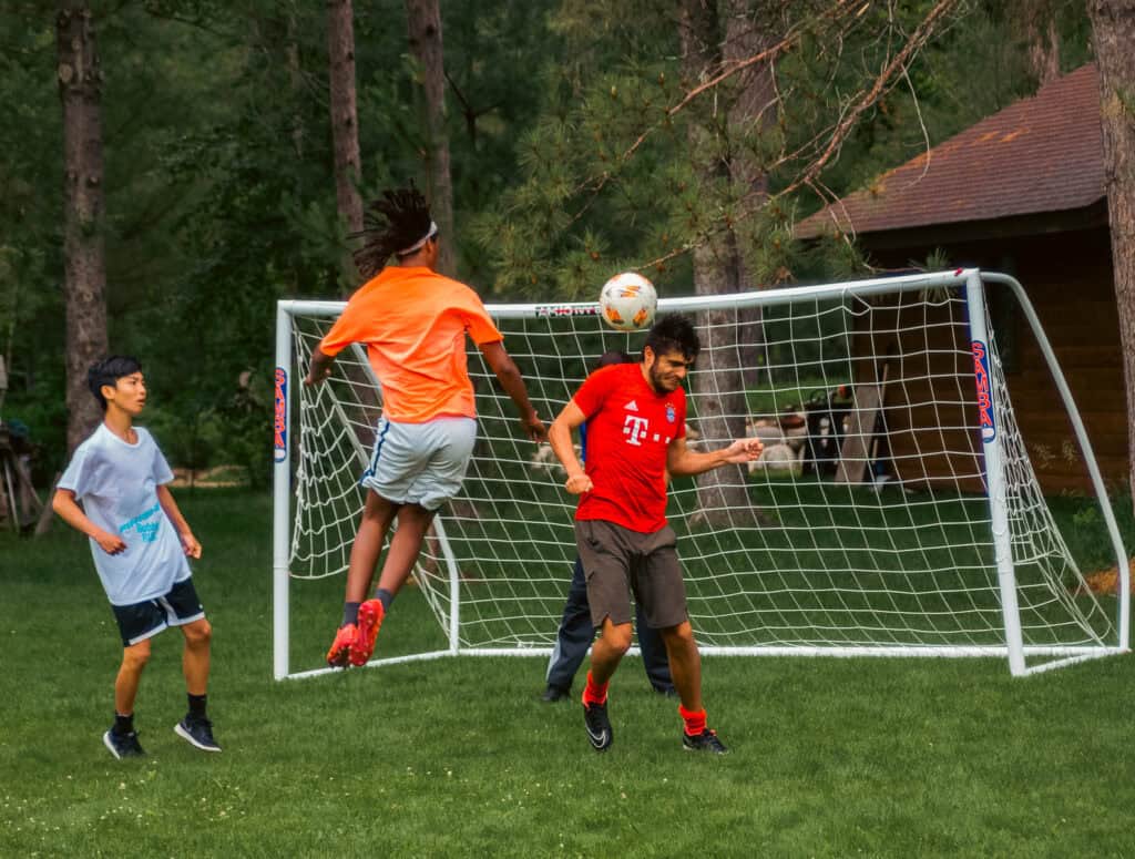 Soccer header at summer camp in northern Minnesota.