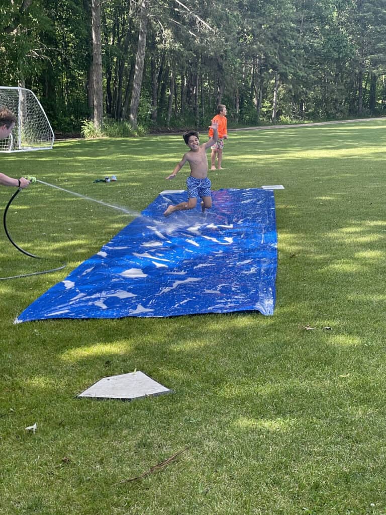 Slip n slide kickball down at the Ivy Bowl at Camp Chippewa for Boys near Bemidji Minnesota.