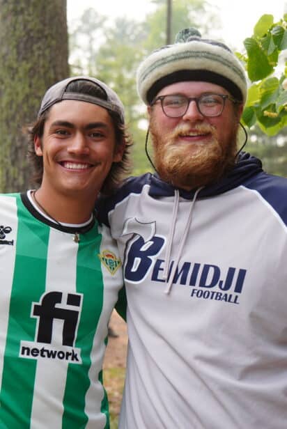 two counselors smiling at summer camp.